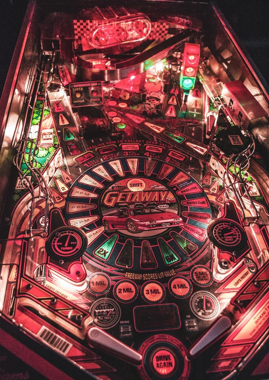 Glowing arcade screen detail in the Arcadia Lounge app
